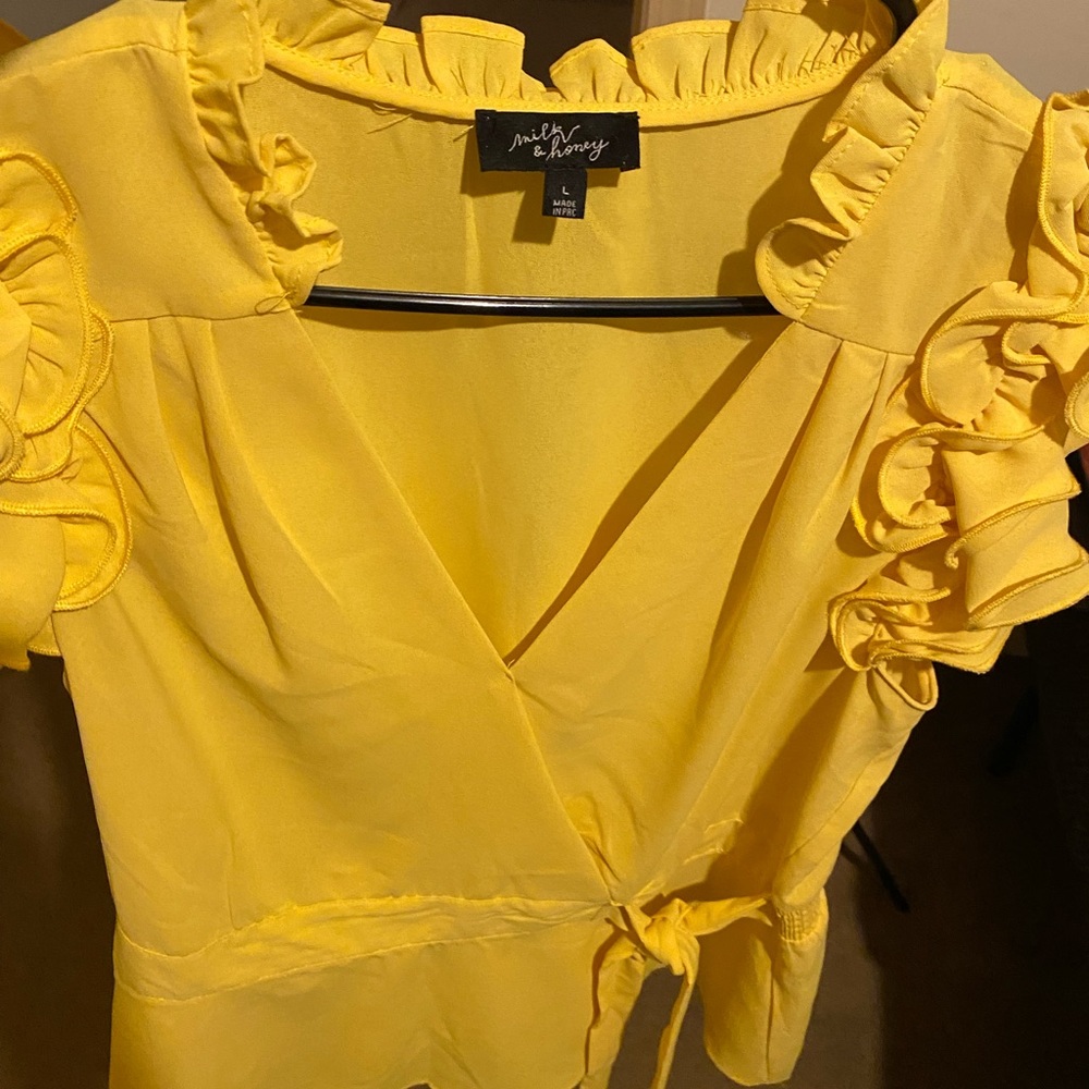 Yellow With Ruffles Around The Neck and Shoulder